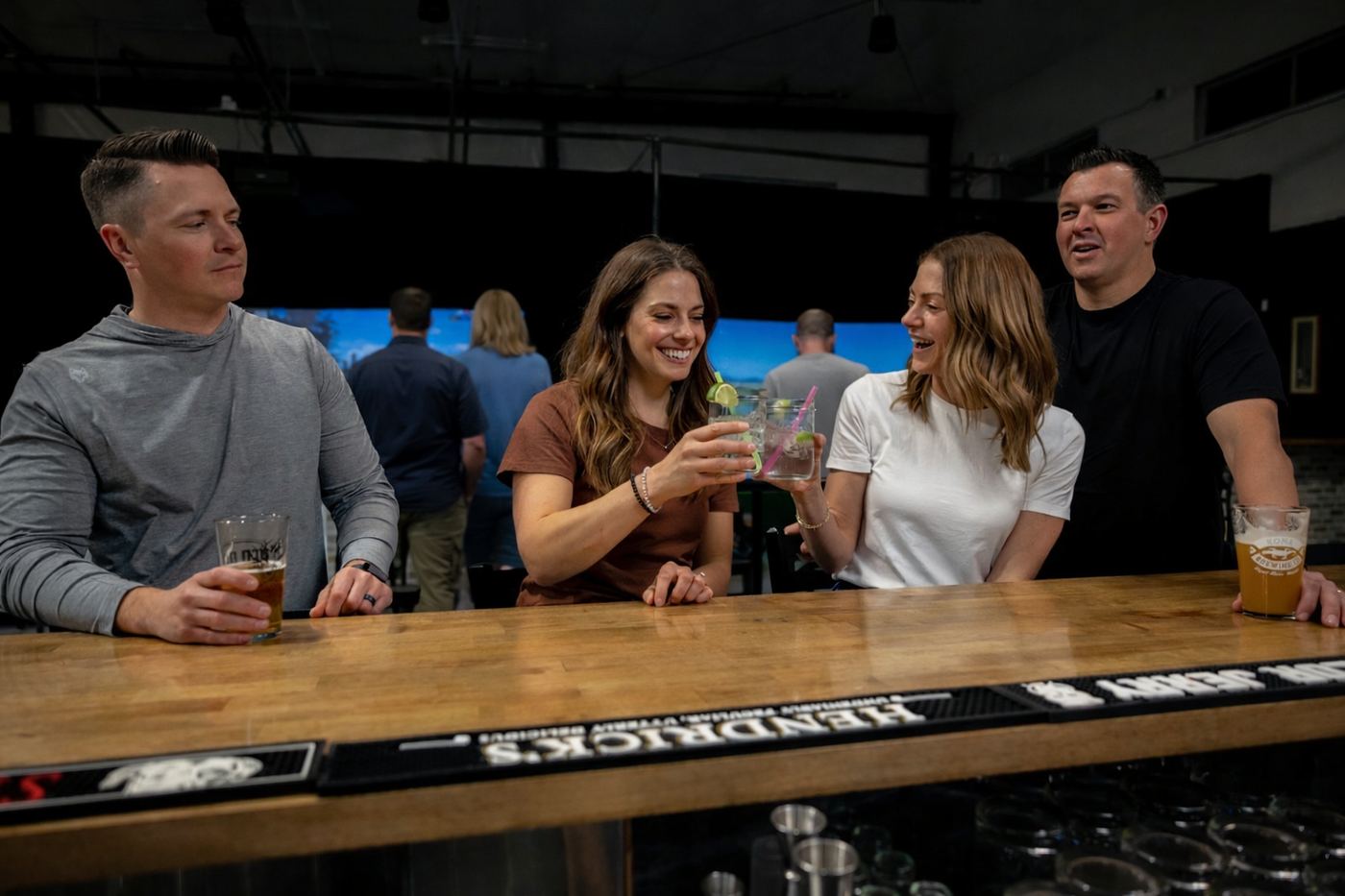 Friends toasting drinks at the Hitters bar
